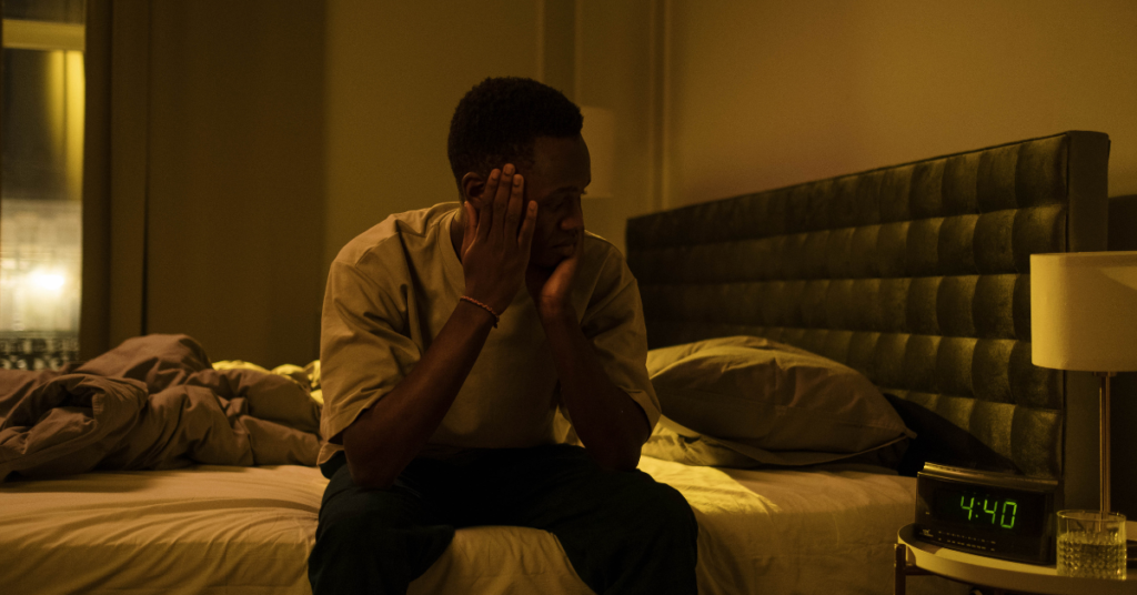 Man sitting in a bedroom up at 4:40am. Insomnia is a symptom of anxiety. Being up all night can make anxiety more difficult. Learn about ACT Treatment for anxiety near Birmingham, AL from counselors in Alabama serving Auburn, Tuscaloosa and beyond.