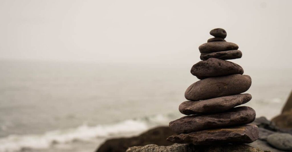rocks balanced on top of each other representing mindfulness/ mindfulness skills/ acceptance commitment therapy for depression counseling/ empower counseling/  35209 35223 35216