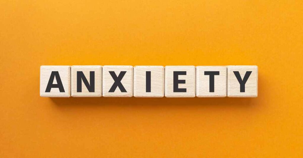 Image of building blocks that spell out anxiety on an orange background.  Discover how an ACT treatment plan for anxiety with a skilled Birmingham therapist can help you heal from your anxiety symptoms.