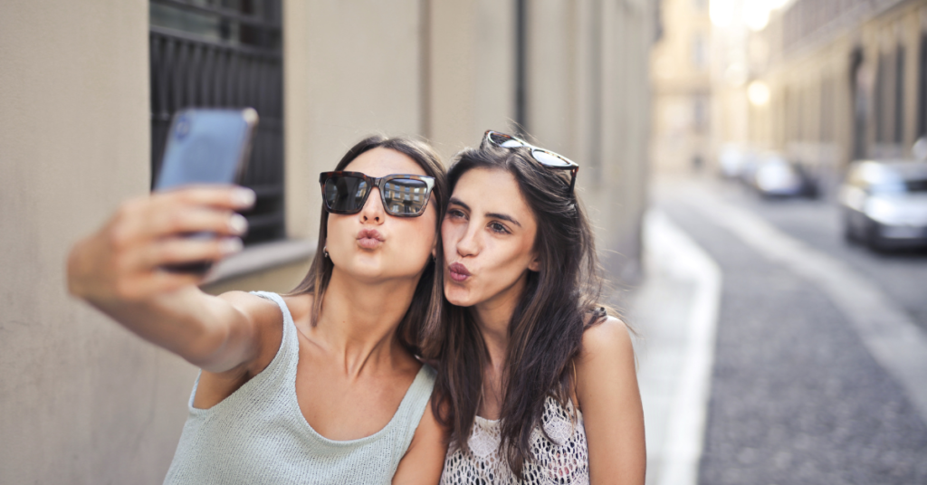 two college woman taking selfie