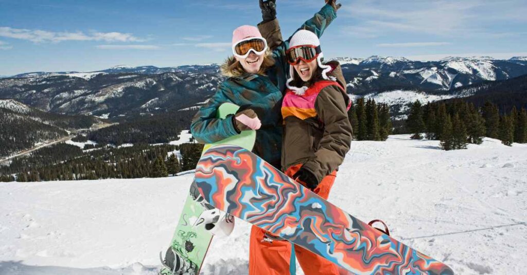 two triumphant snow boarders/ therapy for perfectionism