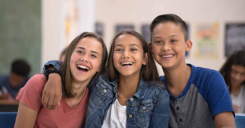 3 young teens smiling