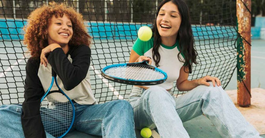 Two young teens after playing tennis