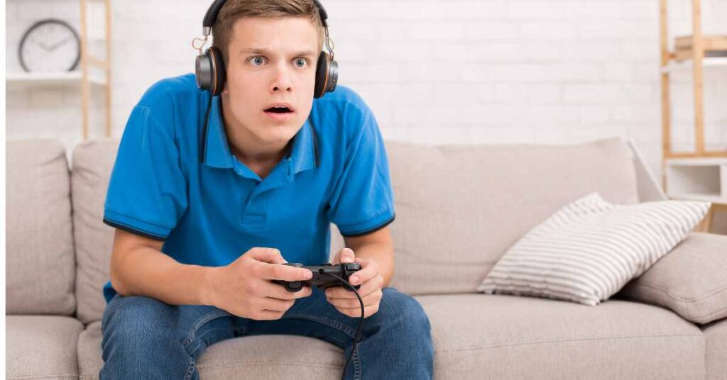 teen boy playing video games/ teen therapy for time management/ Birmingham Al/ Empower Counseling