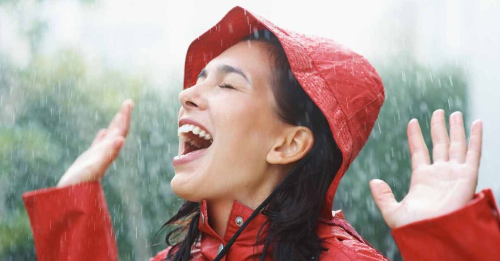 Woman enjoying the rain