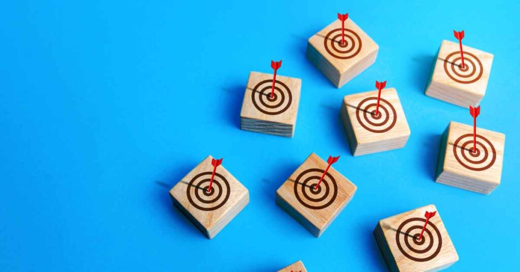 small wooden targets with dart in bullseye