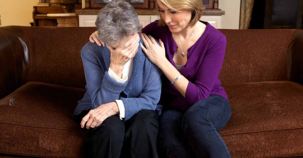 a woman consoling an older woman