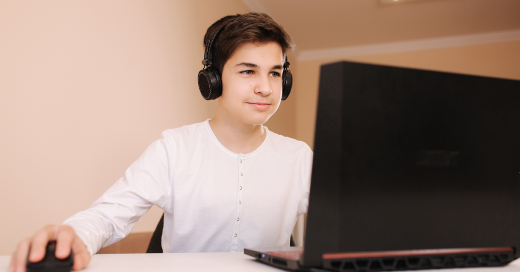 a teen at a computer
