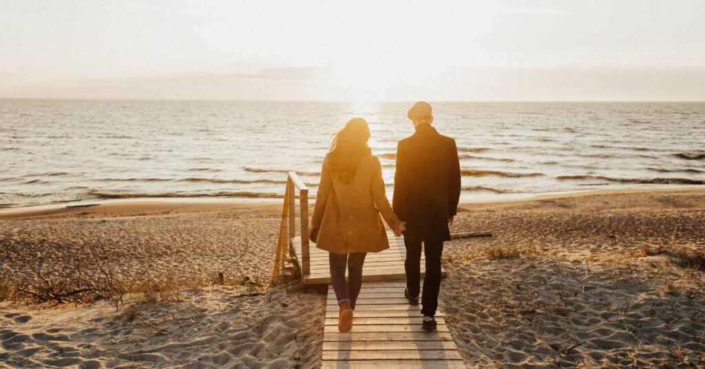 a codependent couple walking to beach/ therapy for codependency Birmingham/ 35223