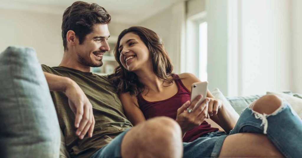 a happy couple on sofa