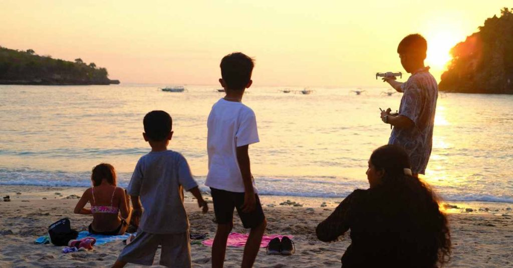 a family enjoying themselves on beach