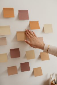 anxious woman putting up sticky notes/ anxiety counseling/ Birmingham/ 35223